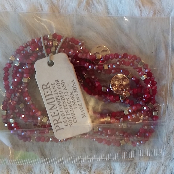 Gold Victoria's secret bag filled with a variety of beauty products. - Picture 9 of 13